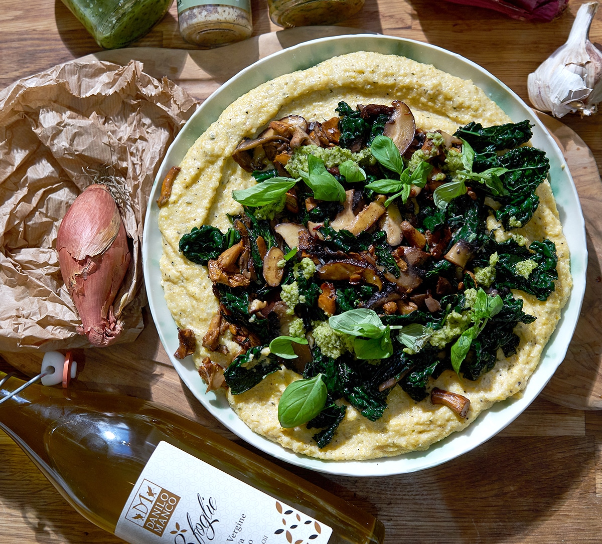 Seasonal mushrooms & greens on cheesy polenta