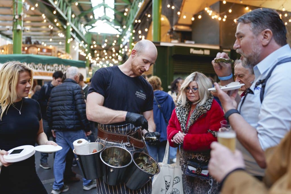 Roaming oyster shucker at the Evening of Seafood