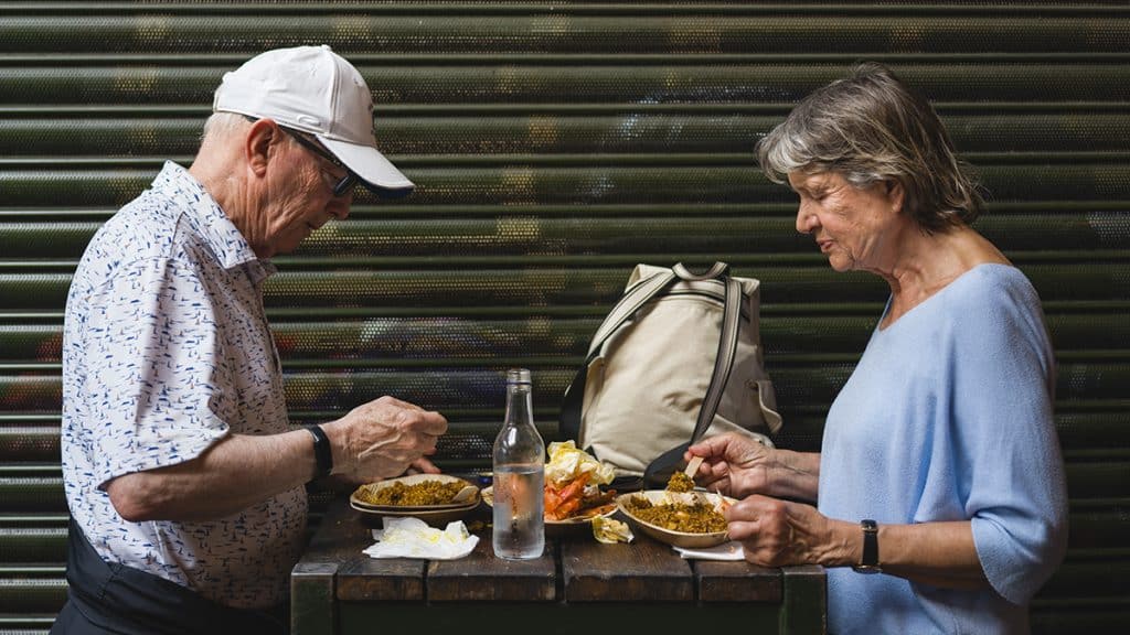 A couple eating street food 